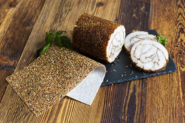 Pork back fat from a ham cooker in a spice casing