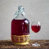 Lady demijohn 5 L with a mechanical closure and a plastic basket - 12 